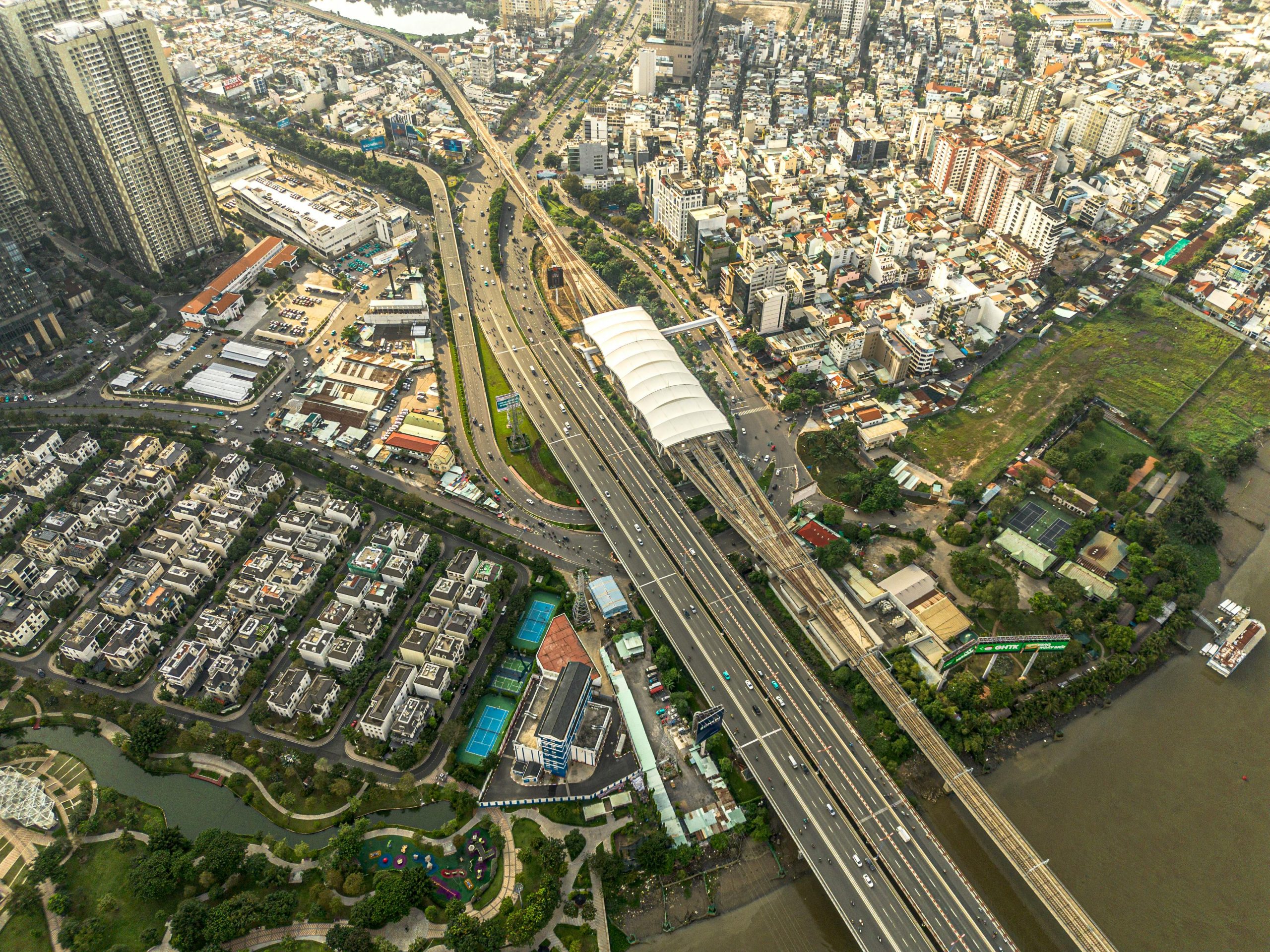 Aerial photo showcasing the bustling urban landscape and highways of Ho Chi Minh City.