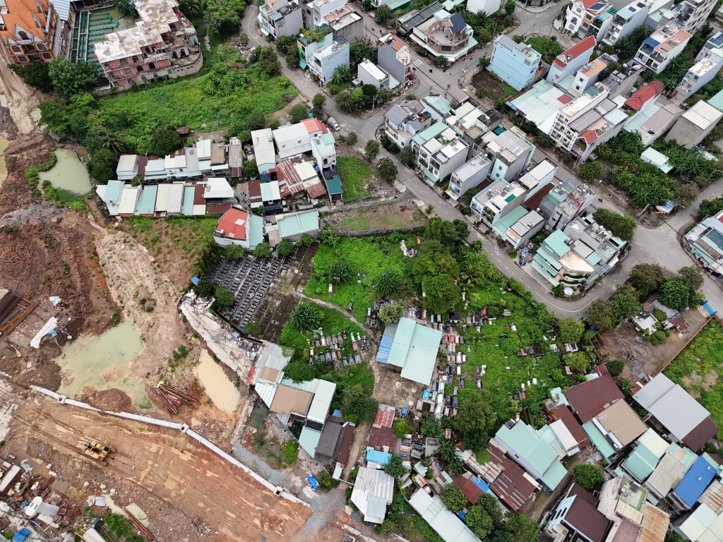 Aerial view of a densely populated urban neighborhood with diverse architecture in Ho Chi Minh City, Vietnam.